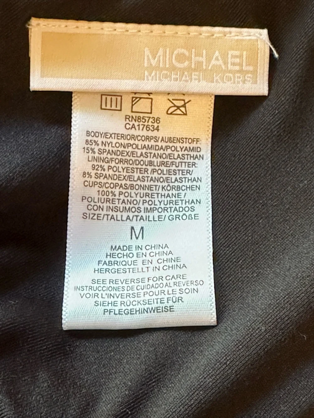 NWOT Michael Kors Black Logo Ring Bikini Swim Top, Size Medium.